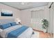 Comfortable bedroom featuring hardwood floors, soft lighting, and ample natural light for a relaxed ambiance at 136 Coble Ave, Albemarle, NC 28001
