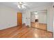 Bedroom with hardwood floors, closet, and a decorative wallpaper for a cozy feel at 136 Coble Ave, Albemarle, NC 28001