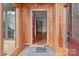 Inviting foyer featuring wood-paneled walls with an open view into a naturally lit entryway at 136 Coble Ave, Albemarle, NC 28001