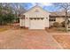 Spacious single-car garage with a brick-paved driveway for easy access at 136 Coble Ave, Albemarle, NC 28001