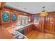 Vintage style kitchen with wooden cabinets, pink countertops, stained glass decor, and natural light at 136 Coble Ave, Albemarle, NC 28001