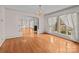 Bright living room featuring hardwood floors, a fireplace, and large windows with natural light at 136 Coble Ave, Albemarle, NC 28001