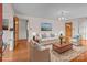 Staged living room with hardwood floors, comfortable seating, and elegant decor at 136 Coble Ave, Albemarle, NC 28001