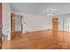 Bright living room with hardwood floors, a chandelier, and natural light at 136 Coble Ave, Albemarle, NC 28001