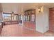A covered porch with red brick flooring and lots of space at 136 Coble Ave, Albemarle, NC 28001