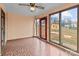 Bright sunroom with patterned tile floors, ceiling fan, and views of the backyard at 136 Coble Ave, Albemarle, NC 28001