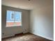 New bedroom with a bright window, neutral paint, and clean lines; ready for customization at 140 First St, Huntersville, NC 28078