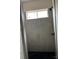 Modern shower featuring gray tiling, black fixtures, and a window for natural light at 140 First St, Huntersville, NC 28078
