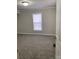 A cozy bedroom featuring neutral paint, plush carpet, and a bright window at 150 Twisted Oak Ln, Gastonia, NC 28052