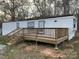 Close-up exterior view of a single-story home with a wood deck at 150 Twisted Oak Ln, Gastonia, NC 28052