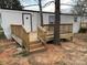 A home featuring a wooden front porch and entryway at 150 Twisted Oak Ln, Gastonia, NC 28052