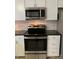 Updated kitchen with modern stainless steel oven and microwave at 150 Twisted Oak Ln, Gastonia, NC 28052