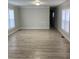 Spacious living room with light-colored walls and light wood flooring at 150 Twisted Oak Ln, Gastonia, NC 28052