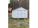 A white shed with black hardware and an American flag at 150 Twisted Oak Ln, Gastonia, NC 28052