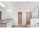 This modern bathroom is equipped with double sinks, granite countertops, and a tiled walk-in shower at 15119 Oleander Dr, Charlotte, NC 28278