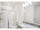 Modern bathroom featuring granite countertops, a glass-enclosed shower, and ample natural light at 15119 Oleander Dr, Charlotte, NC 28278