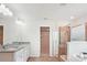 Bright bathroom featuring double sinks with granite countertops and a separate shower with glass door at 15119 Oleander Dr, Charlotte, NC 28278