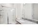 Bathroom with glass shower, granite counters, and bright lighting at 15119 Oleander Dr, Charlotte, NC 28278