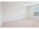 Spacious bedroom with neutral carpeting, a window for natural light, and minimalist design at 15119 Oleander Dr, Charlotte, NC 28278
