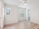 Empty bedroom showcasing natural light and wood laminate flooring at 15119 Oleander Dr, Charlotte, NC 28278