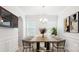 Bright dining room featuring modern chandelier, large window and elegant decor at 15119 Oleander Dr, Charlotte, NC 28278