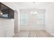 Bright dining room featuring modern chandelier, large window and elegant molding at 15119 Oleander Dr, Charlotte, NC 28278