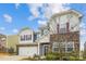 Exterior of a stunning two-story home with a stone facade, red shutters, and well-maintained landscaping at 15119 Oleander Dr, Charlotte, NC 28278