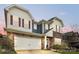Charming two-story home boasts a stone facade, neutral siding, red shutters, and a spacious two-car garage at 15119 Oleander Dr, Charlotte, NC 28278