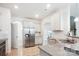 Bright kitchen features stainless steel appliances, granite countertops and white cabinets at 15119 Oleander Dr, Charlotte, NC 28278