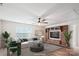 Staged living room with hardwood floors, ample natural light, and comfortable seating at 15119 Oleander Dr, Charlotte, NC 28278