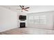 Living room featuring a cozy fireplace and large windows for natural light at 15119 Oleander Dr, Charlotte, NC 28278