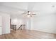Open loft area showcasing the high ceiling, fan, and wood laminate flooring at 15119 Oleander Dr, Charlotte, NC 28278