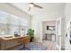 Bright and airy home office with a large window, desk, ceiling fan, and a bonus room connected with french doors at 15119 Oleander Dr, Charlotte, NC 28278