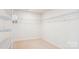 This walk-in closet has an integrated storage system with shelving and plenty of room for organizing belongings at 15119 Oleander Dr, Charlotte, NC 28278