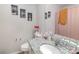 Bathroom with granite countertops, decorative wall art, and combination shower-tub at 1751 Holliford Ct, Charlotte, NC 28215