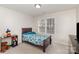 Cozy bedroom featuring natural light, neutral walls, and a comfortable twin bed at 1751 Holliford Ct, Charlotte, NC 28215