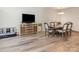 Dining room features modern flooring, a wall-mounted TV, and a classic dining set for Gathering gatherings at 1751 Holliford Ct, Charlotte, NC 28215