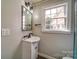 Charming bathroom featuring a modern vanity with stylish fixtures and window for natural light at 204 Julia Ave, Belmont, NC 28012