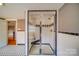 A tiled bathroom featuring a glass enclosed shower and black and white tiled floor at 204 Julia Ave, Belmont, NC 28012