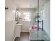 Bathroom features a glass shower, modern vanity and a window for natural light at 204 Julia Ave, Belmont, NC 28012