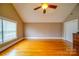 Bright bedroom featuring hardwood floors and a window for natural light at 204 Julia Ave, Belmont, NC 28012