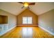 Bright bedroom featuring hardwood floors and a window, offering natural light at 204 Julia Ave, Belmont, NC 28012
