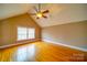 Spacious bedroom with gleaming hardwood floors and a bright window at 204 Julia Ave, Belmont, NC 28012