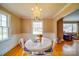 Cozy dining area featuring a charming chandelier and seamless connection to the living area, perfect for modern living at 204 Julia Ave, Belmont, NC 28012