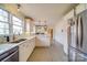 Spacious kitchen featuring stainless appliances, custom cabinetry, and eat in bar at 204 Julia Ave, Belmont, NC 28012