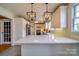 Bright white kitchen with stainless appliances, custom cabinetry, and eat in bar at 204 Julia Ave, Belmont, NC 28012