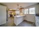 Well-lit kitchen with custom cabinetry, stainless appliances, and eat in bar at 204 Julia Ave, Belmont, NC 28012