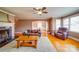 Comfortable living space featuring a fireplace and seamless flow to the dining area, perfect for entertaining and relaxing at 204 Julia Ave, Belmont, NC 28012