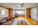 Bright living room with hardwood floors, ample natural light, and comfortable seating, perfect for relaxation and entertainment at 204 Julia Ave, Belmont, NC 28012