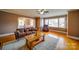 Inviting living room featuring hardwood floors, large windows, and comfortable seating, perfect for relaxing or entertaining at 204 Julia Ave, Belmont, NC 28012